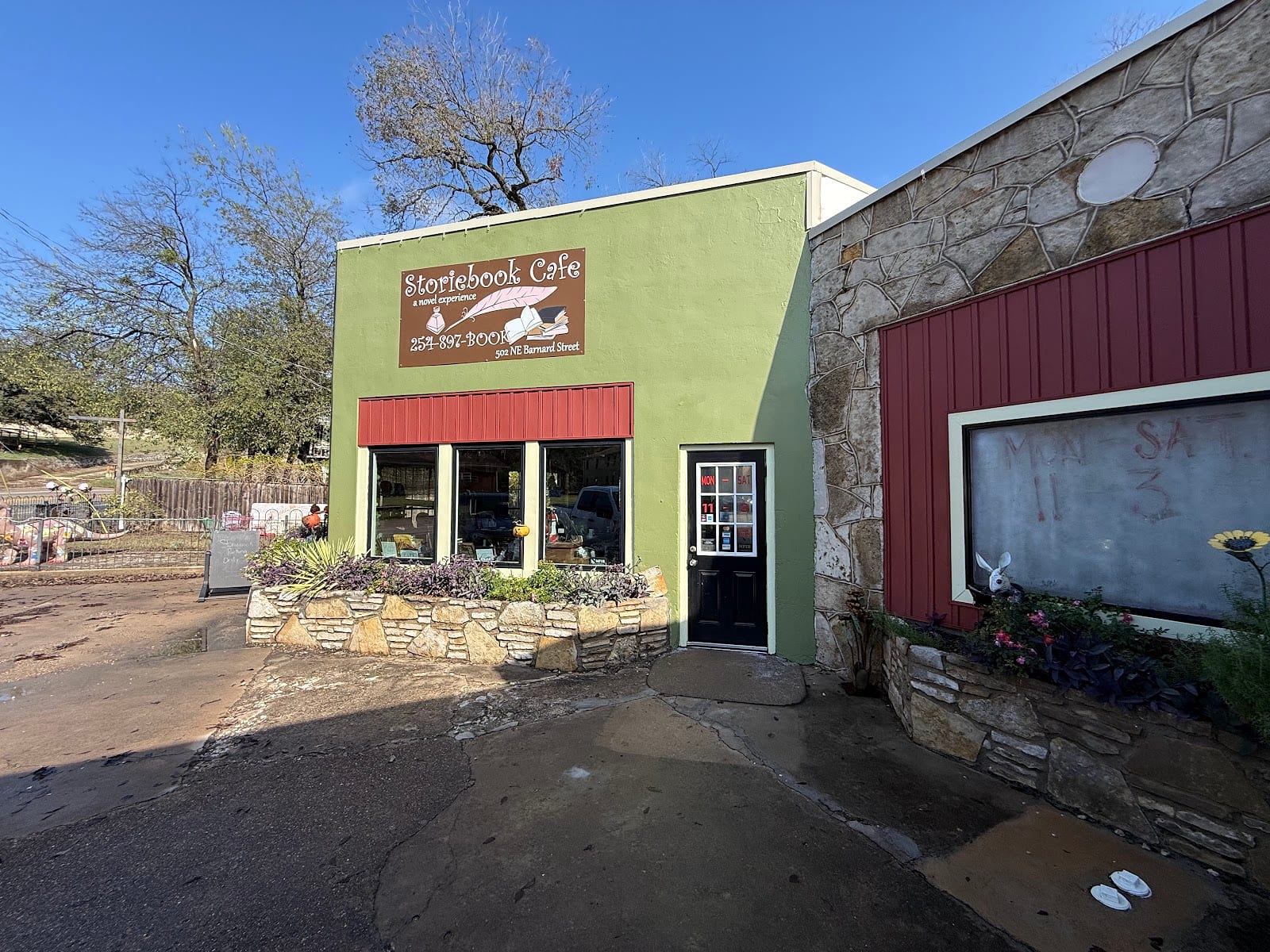 The green storefront of Storiebook Cafe in Glen Rose.